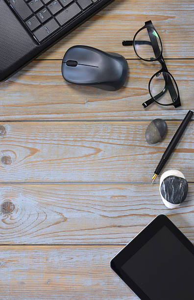 istock Wooden desk table with laptop computer in the office 585584980
