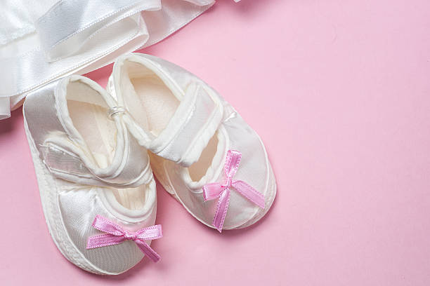 istock Clothes for baby girl on a pink background. Copy space 585585130