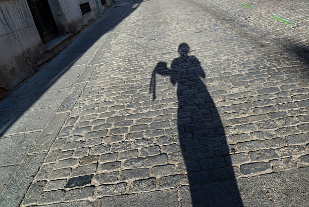 istock Shadow of a woman holding a hat 585585408