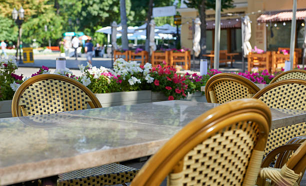 istock empty street cafe interior, tables and chairs, ornate with flowers 585586010