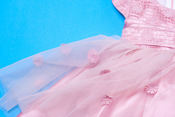 istock Clothes for baby girl on light blue background. Copy space 585586376