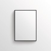 istock White blank poster with frame mock-up on grey wall 585589696