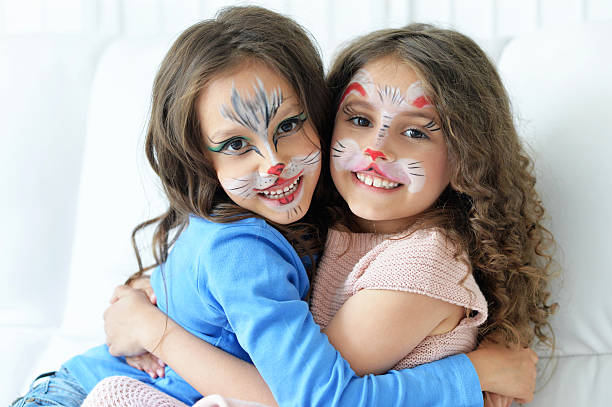 istock little girls with face painted 585589848