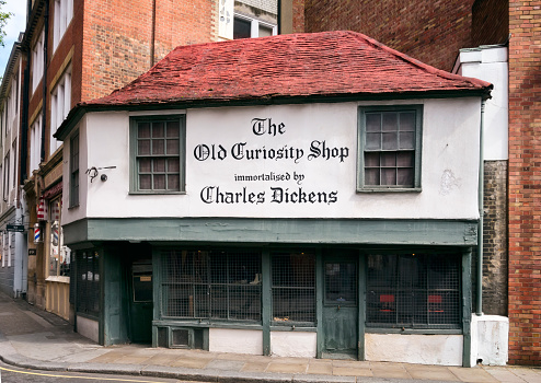 London, England - May 17, 2016: The Old Curiosity Shop in Portsmouth Street, Central London. The Old Curiosity Shop was built c1567 and is reputed to be the oldest shop in London, which currently stocks handmade shoes. It is thought to be the inspiration for Charles Dickens’ novel of the same name, although it acquired that name after the publication of the book.