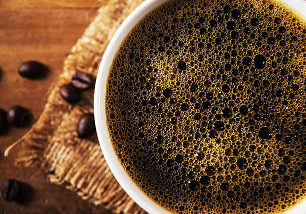 istock Closeup coffee cup with coffee bean in still life tone 585590664