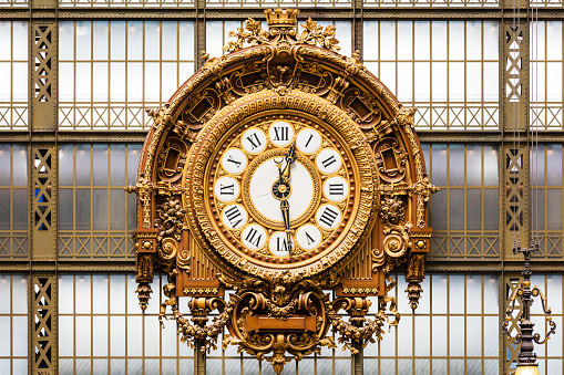 Paris, France - Jule 08, 2016: Golden clock of the museum D'Orsay.The Musee d'Orsay is a museum in Paris, on the left bank of the Seine. Musee d'Orsay has the largest collection of impressionist and post-impressionist paintings in the world.