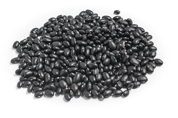 istock Close-up on a Black beans in white background. Phaseolus vulgari 585593448