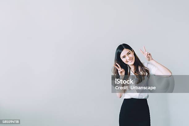 Asian University Girl Doing Funny Rabbit Pose With Copy Space Stock Photo - Download Image Now
