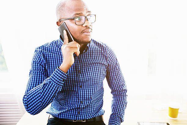 istock Portraite of a man talking on the cellphone at workplace 585595092