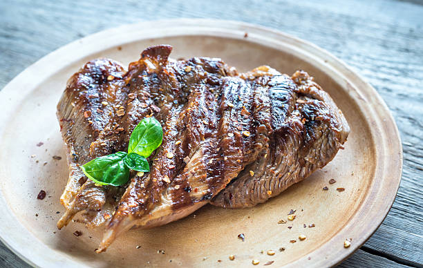 istock Grilled turkey on the wooden board 585595264