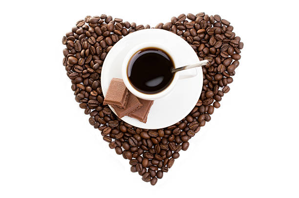istock white cup of coffee on  beans as a heart 585596614