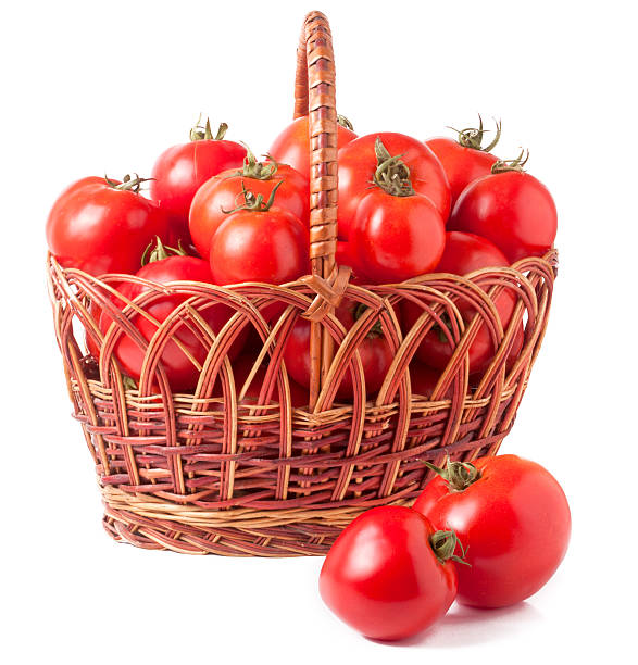 istock red tomatoes in a wicker basket isolated on white background 585597014