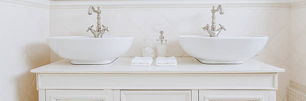 istock Elegant washbasins in white bathroom 585598992