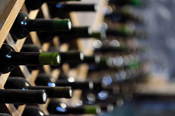 istock Wine bottles stacked on wooden racks 585600852