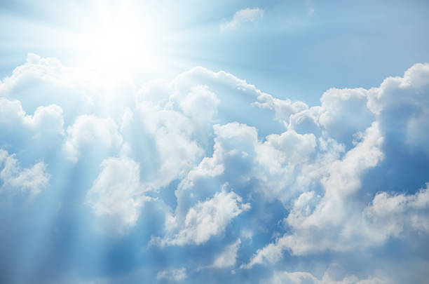 istock Bright sun shines among the white clouds 585601020