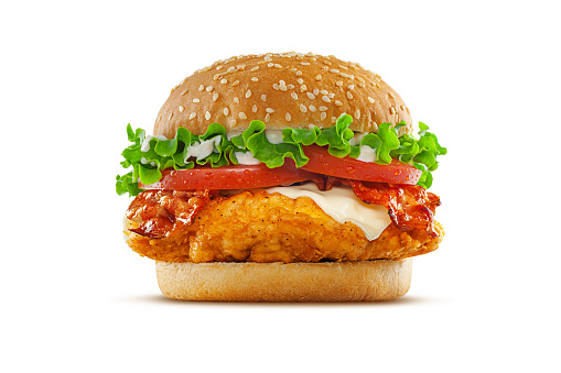 High resolution, digital capture of a fried chicken club sandwich with lettuce, tomatoes, mayonnaise, cheese, and crispy bacon, on a fresh sesame seed bun, set against a clean, white background sweep. Shot in an aspirational advertising style.