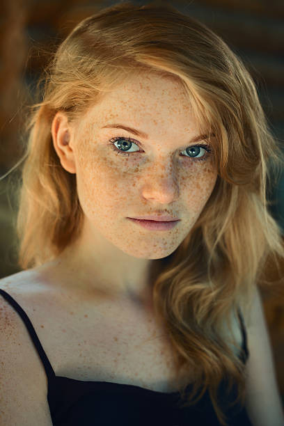 istock Freckles, red-haired woman 585603442