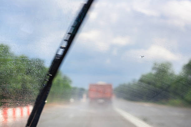 istock wiping windscreen during driving car on highway 585604096