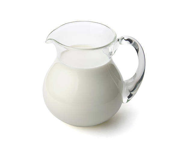 istock Milk in a glass jug isolated with clipping path. 585604568