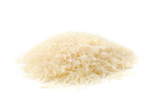 istock parboiled rice, natural long  isolated. 585604856