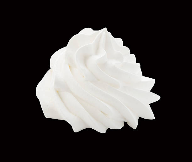 istock Whipped cream isolated on a black background with clipping path 585605564