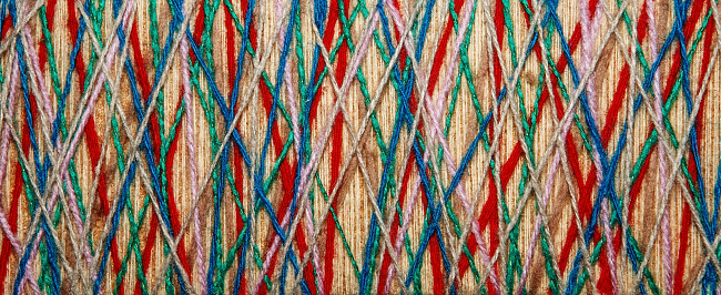 The multicolored yarn used for decor. Cobweb from threads