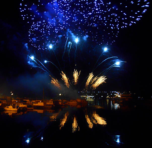 istock fireworks over the water surface in the marina 585606768