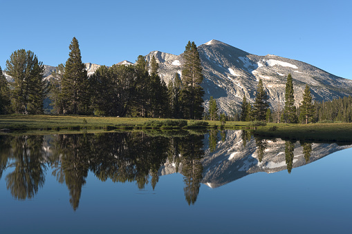 This is blend of five photos into a High Dynamic Range composition of dawn at a small pond at nearly 10,000 feet (3,050 m) at Tioga Pass, Yosemite National Park, California, with Mount Dana in the background.