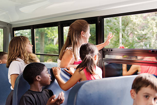 istock School kids on school bus 585609902