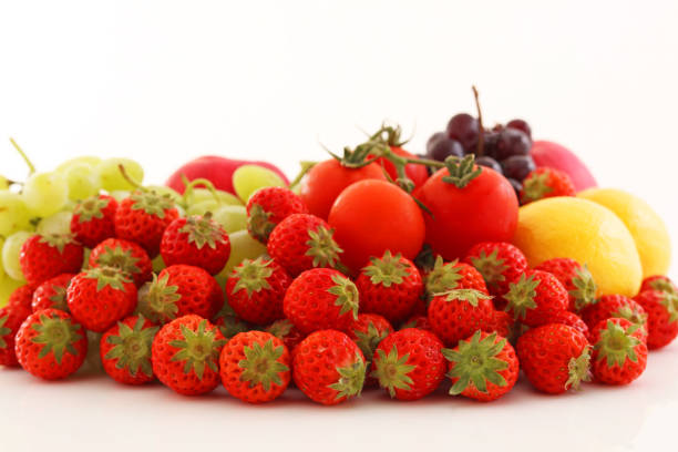 Fresh vegetables and fruits on white background