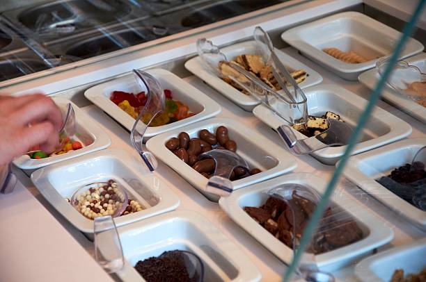 istock Cropped image of a man decorating ice-cream 585610184