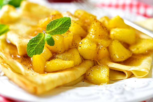 istock Thin pancakes with caramelised apples and cinnamon. 585610876
