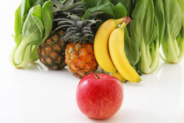 Fresh vegetables and fruits on white background