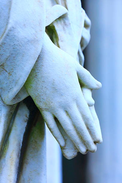 istock Religion hope: Virgin Mary praying hands marble, Recoleta cemetery 585611650