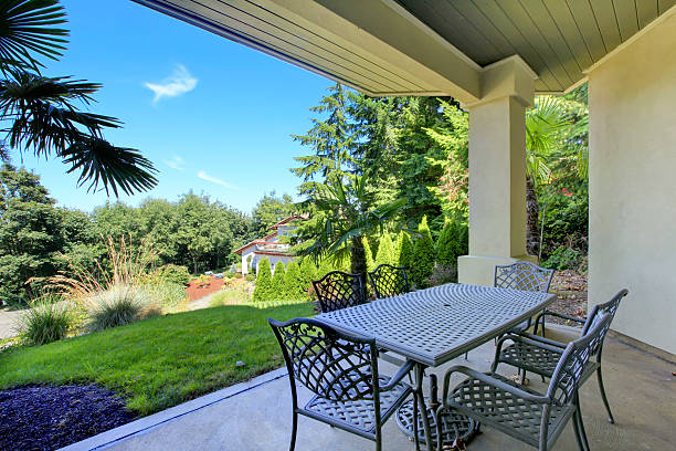istock Front covered porch interior of new luxury home. 585611714
