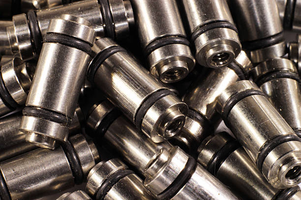istock Many metal rods with rubber rings and threaded holes 585612384