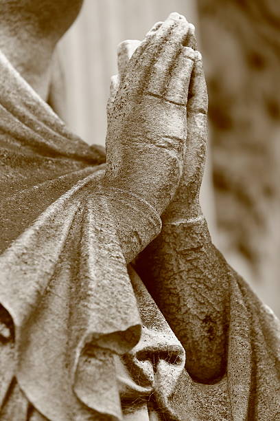 istock Religion hope: Madonna praying hands clasped, Recoleta cemetery 585612874