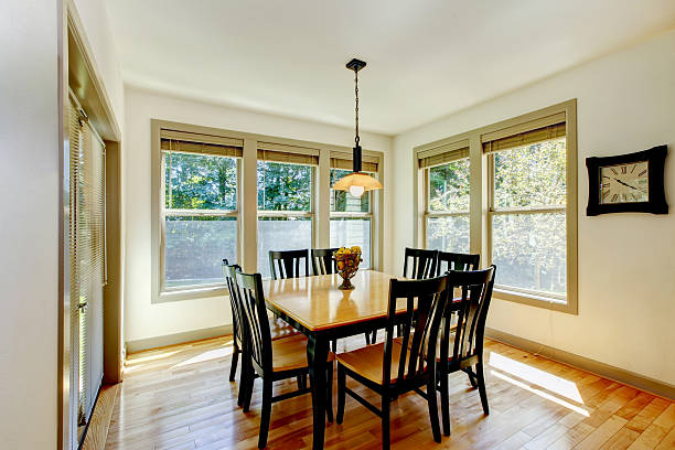 istock Dining area with wooden table set and hardwood floor 585613146
