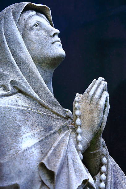 istock Religion hope: Madonna praying hands looking to skies, Recoleta 585613192