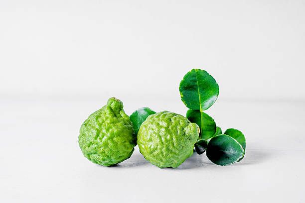 istock Bergamot fruit on white wooden  background . 585615942