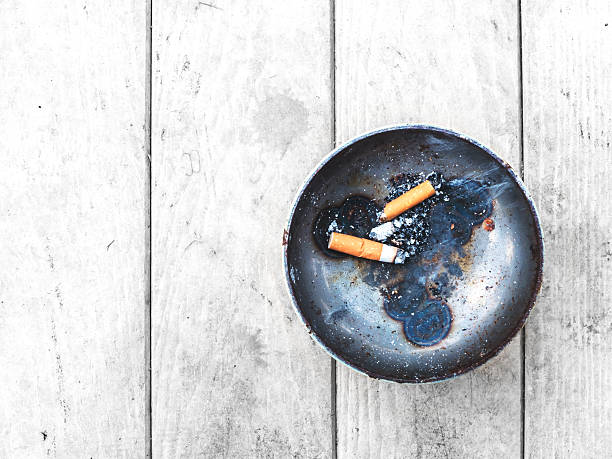 istock cigarette and metal ashtray 585618580