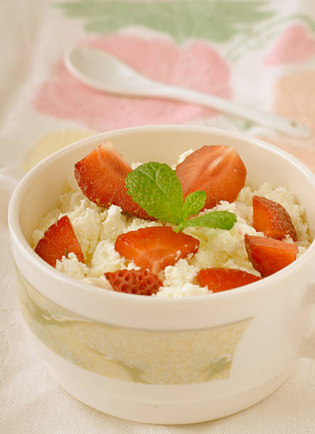 istock Breakfast with farmer cottage cheese, strawberries and mint 585618586