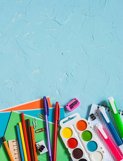 istock School supplies and accessories on a blue background 585619676