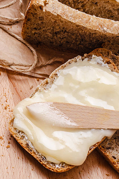 istock Still life fresh bread with butter and honey 585619686