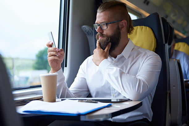istock Businessman looking at mobile phone 585622534