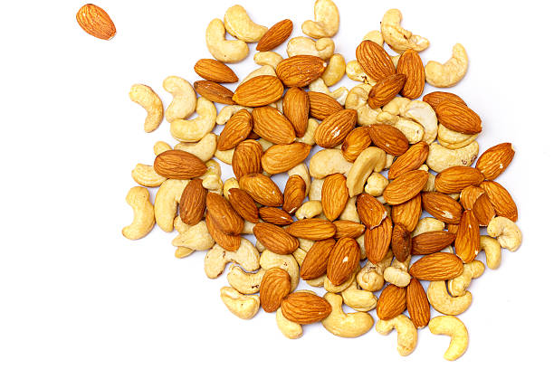 istock Nuts mix close-up. Cashews and almonds. 585624284