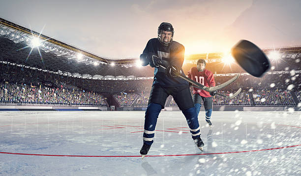 istock Hockey match at rink  . Mixed media 585624902