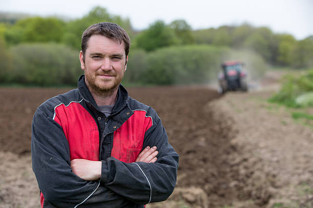 istock farmer showing new tractor 585628208