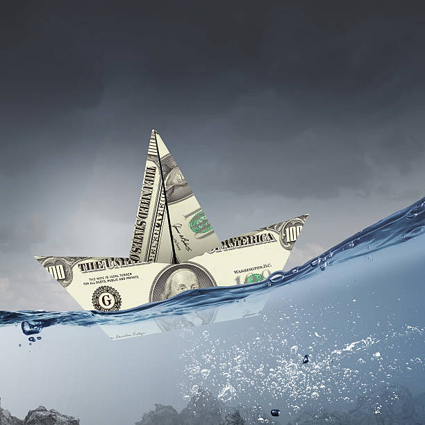 istock Dollar paper boat . Mixed media 585629042