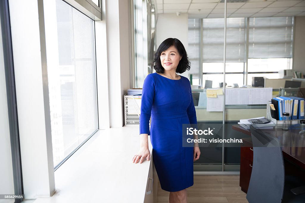 successful chinese business woman mature, middle-aged woman is a successful business person Asia Stock Photo